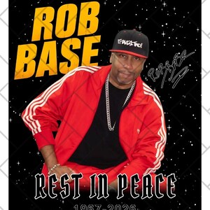 May include: Digital download featuring a portrait of Rob Base in a red track jacket, black shirt, and a baseball cap. The image includes the text "ROB BASE" in yellow, "REST IN PEACE," and the years 1967-2026.