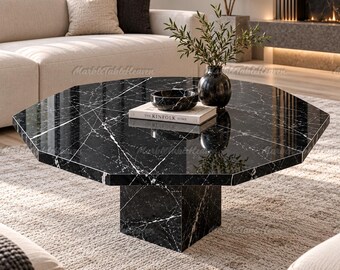 Mesa de centro octogonal de mármol negro, estilo Nero Marquina, con base de pedestal moderna.