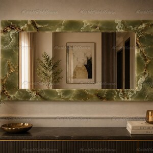 May include: A rectangular wall mirror featuring a polished green onyx frame with natural white and brown veining. The mirror has a smooth, reflective surface and is mounted horizontally, showcasing a distinct stone pattern throughout the border.
