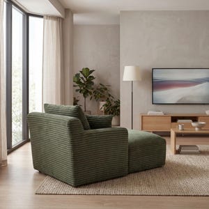 May include: A green corduroy armchair with an attached ottoman sits on a neutral-toned rug. The chair is in a modern living room setting, with a large window, plants, and a wooden entertainment center with a television.
