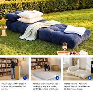 May include: A navy blue corduroy floor cushion with a tufted design, topped with white and cream pillows and a light green blanket. The cushion is on a grassy lawn, with a lantern and a tray with a glass of wine and figs.