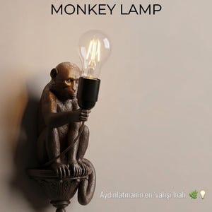 Lámpara de pared de mono