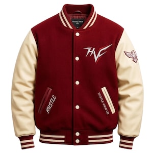 May include: A maroon and cream varsity jacket with the text "Hustle View Co." and "Hustle". The jacket has cream-colored sleeves, a maroon body, and white stripes on the cuffs and hem. The jacket also features a logo on the chest and an emblem on the sleeve.