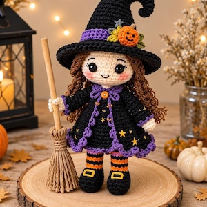 May include: A crocheted witch doll with brown yarn hair, wearing a black pointed hat with a purple band and a small orange pumpkin accent. The doll wears a black dress with purple trim, yellow star embroidery, and orange and black striped stockings.