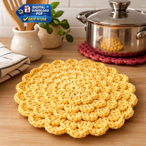 May include: A bright yellow, crocheted trivet with a floral design sits on a wooden surface. A red crocheted trivet and a stainless steel pot are in the background. The image also includes a small plant, wooden utensils, and a PDF download icon.