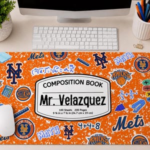 May include: A rectangular desk mat with an orange and white speckled background featuring New York Mets and Knicks logos, math equations, and a central label reading COMPOSITION BOOK, Mr. Velazquez, 100 Sheets 200 Pages, 9 3/4 in x 7 1/2 in.