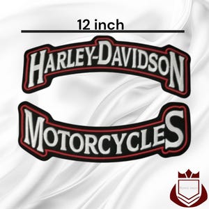 May include: Two embroidered patches featuring the text Harley-Davidson and Motorcycles in white lettering with red and black borders. The patches measure 12 inches in width. The design consists of two curved segments with bold, capitalized font.