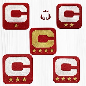 May include: A collection of red, square-shaped embroidered patches. Each patch features a white or gold letter "C" and gold stars. The patches vary in the number of stars, from one to five, and are likely for apparel.