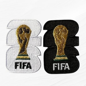 May include: Two embroidered patches featuring the FIFA World Cup trophy in gold, green, and black thread. One patch has a white background and the other has a black background. Both patches display the text FIFA in white or black lettering.