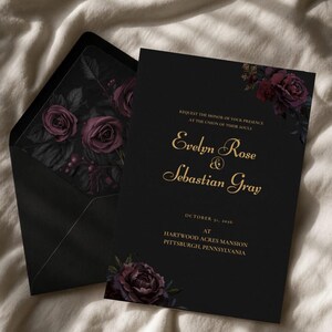 May include: Black wedding invitation with gold text and floral accents. The invitation reads "Evelyn Rose & Sebastian Gray" and includes the date and location. The envelope features a floral design.