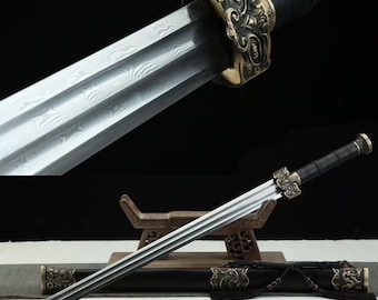 May include: A straight sword featuring a double-edged steel blade with a visible wavy pattern, a black wrapped handle, and a bronze-colored guard with intricate relief carvings. The sword is accompanied by a matching black scabbard with bronze accents.