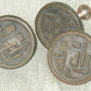 May include: A set of three ceramic mugs with a speckled, matte finish. The mugs are in shades of cream, light gray, and dark gray. Each mug has a simple, minimalist design, perfect for coffee or tea.