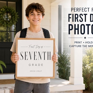 May include: A square wooden sign with a white background and black text that reads First Day of SEVENTH GRADE 2026-2027. The sign features a simple, clean design with thin horizontal lines above and below the text, framed in a light wood border.