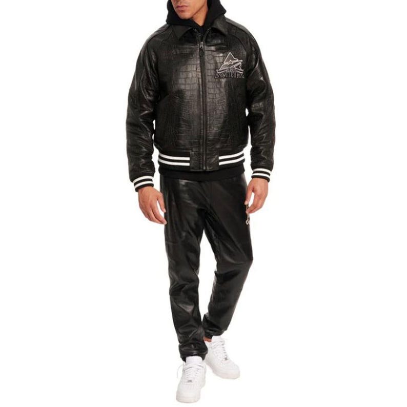 May include: Black leather jacket with a crocodile texture, white stripes on the cuffs and waist, and a logo on the chest. The jacket is paired with matching black leather pants and white sneakers. The outfit is a complete set.