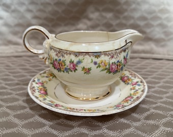 Jarra y platillo de porcelana vintage con diseño floral para crema