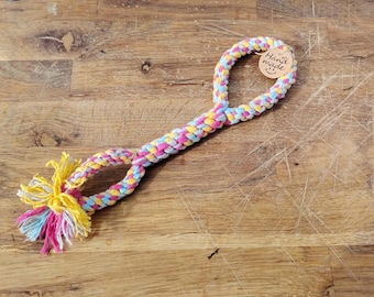 Handmade dog chew toy. Made of cotton with a comfortable handle.