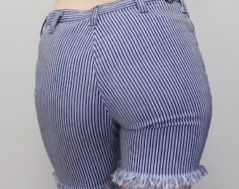 May include: Blue and white striped denim shorts with a frayed hem.