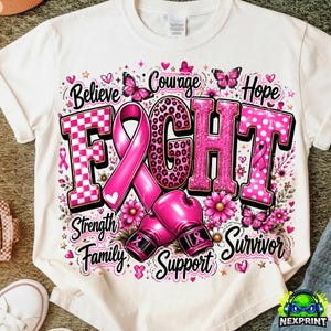 May include: A white t-shirt featuring a graphic design with the word FIGHT in large letters, a pink awareness ribbon, and two pink boxing gloves. The design includes butterflies, flowers, and the words Believe, Courage, Hope, Strength, Family, Support, Survivor.