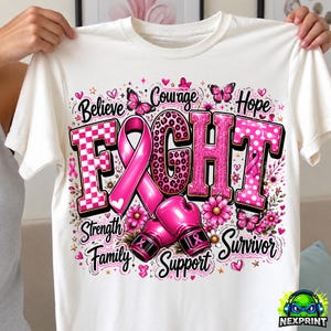 May include: A white t-shirt featuring a graphic design with the word FIGHT in large pink letters, a pink awareness ribbon, and pink boxing gloves. The design includes butterflies, flowers, and the words Believe, Courage, Hope, Strength, Family, Support, Survivor.