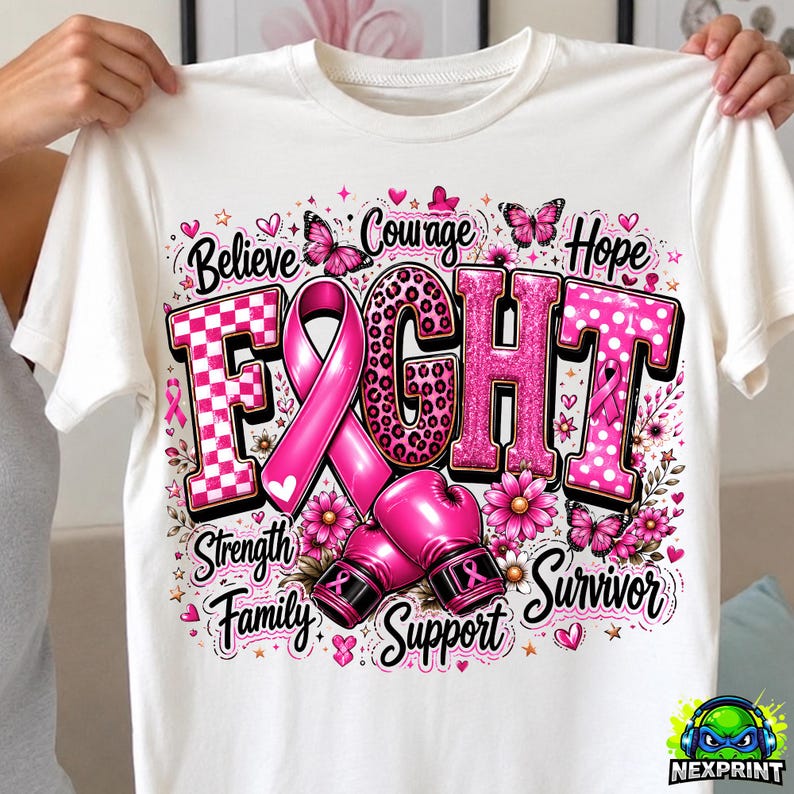 May include: A white t-shirt featuring a graphic design with the word FIGHT in large pink letters, a pink awareness ribbon, and pink boxing gloves. The design includes butterflies, flowers, and the words Believe, Courage, Hope, Strength, Family, Support, Survivor.