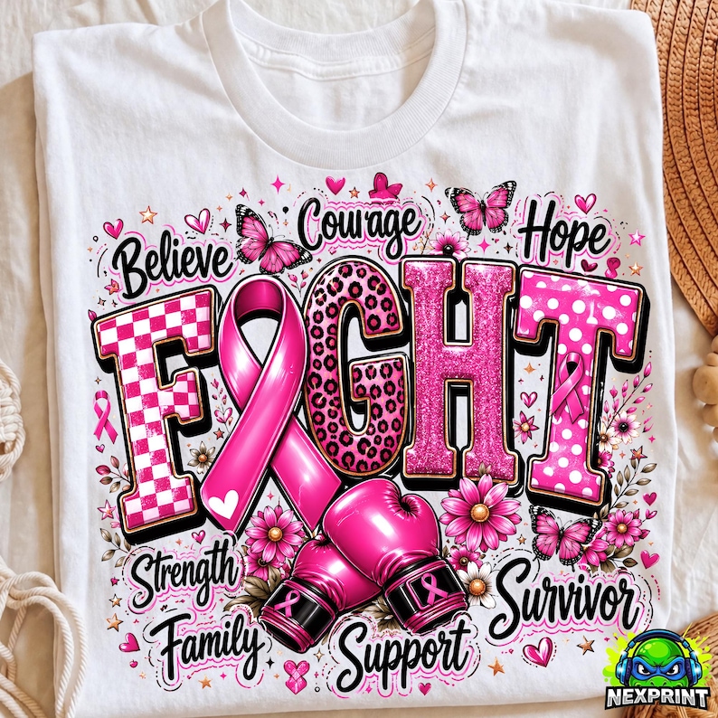May include: A white t-shirt featuring a graphic design with the word FIGHT in large pink letters, a pink awareness ribbon, and two pink boxing gloves. The design includes butterflies, flowers, and the words Believe, Courage, Hope, Strength, Family, Support, and Survivor.