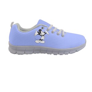 May include: A light blue trainer with a Mickey Mouse cartoon image. The shoe has grey soles, trim, and laces. The design is for comfort and casual wear. The shoe is suitable for everyday activities.