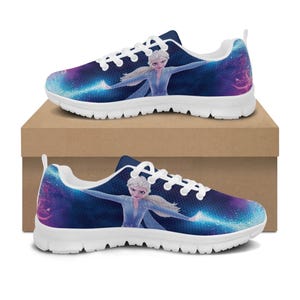 May include: Pair of white-soled sneakers featuring a vibrant design of a character from a popular animated film. The shoes have a dark blue background with a galaxy-like pattern and the character in a light blue dress. The laces are white.