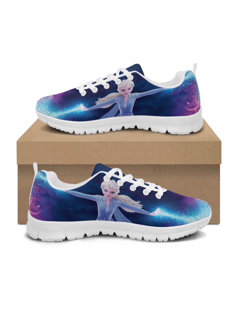 May include: Pair of white-soled sneakers featuring a vibrant design of a character from a popular animated film. The shoes have a dark blue background with a galaxy-like pattern and the character in a light blue dress. The laces are white.