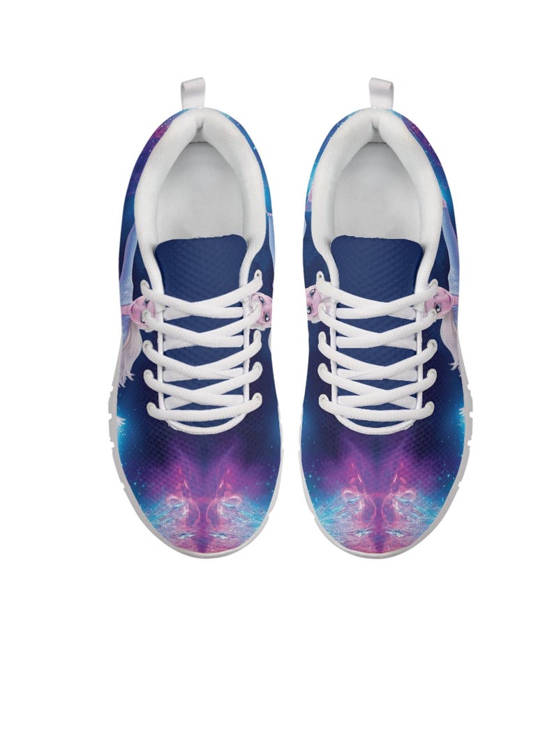 May include: A pair of athletic shoes with a vibrant galaxy design. The shoes feature a dark blue upper with a purple and blue nebula pattern. White laces and a white interior complete the design. The shoes are designed for comfort and style.