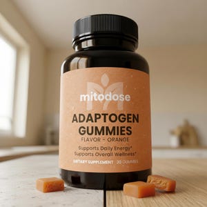 May include: A black bottle of "mitodose" Adaptogen Gummies with an orange label and a black cap. The label reads "Flavor - Orange" and "Supports Daily Energy". Three orange gummies are on the wooden surface.
