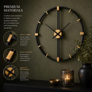 May include: A large circular wall clock featuring a matte black metal frame with brushed gold accents at the hour markers and center. The clock has two thin black hands and is displayed alongside text detailing premium materials and quality movement.