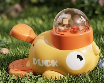 Juguete interactivo para perros con forma de pato que dispensa golosinas.
