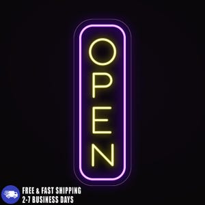 May include: A neon sign with the word "OPEN" in yellow against a black background. The sign has a purple border and a rectangular shape with rounded corners. The text is vertically aligned.