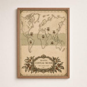 May include: A framed vintage-style world map print titled Mappa Coffeae Mundi, The Coffee Belt. The map features a beige background with a green horizontal band highlighting coffee-growing regions, marked with coffee plant illustrations.