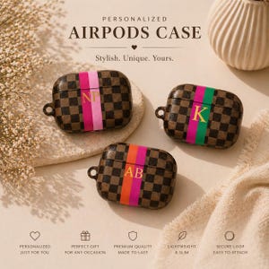 May include: Three personalized AirPods cases with brown checkered patterns and colorful stripes. Each case features initials: "NP", "K", and "AB". The text "PERSONALIZED AIRPODS CASE" is at the top.
