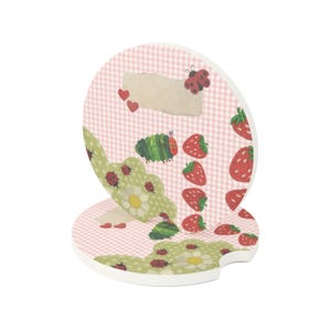 May include: Two round car coasters featuring a light pink gingham pattern, red strawberries, green caterpillars, ladybugs, small red hearts, and green scalloped shapes with white flowers. Each coaster has a small notch on the side.