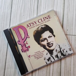 May include: A CD case with a photo of Patsy Cline on the front. The title of the album is "Loved and Lost Again" and features the songs "I've Loved And Lost Again", "Then You'll Know", "Hungry For Love", and "And More!!!".