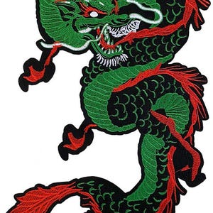 May include: Embroidered patch featuring a green and red dragon on a black background. The dragon has detailed scales, a fierce expression, and flowing red accents. This patch is suitable for jackets, bags, or other fabric items.