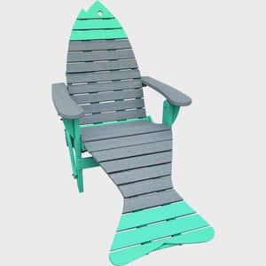 May include: A fish-shaped outdoor chair featuring horizontal slats in alternating shades of mint green and slate gray. The chair includes two armrests, a tall backrest with a small circular cutout at the top, and a wide, extended seat base.