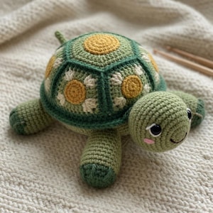 May include: A handmade crochet turtle in shades of green, yellow, and white. The turtle's shell features a floral design with yellow centers and white petals. The turtle has a smiling face and is made of soft yarn.