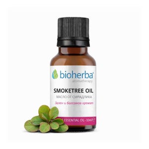Puede incluir: Una botella de vidrio marrón de aceite de Smoketree con una tapa negra, etiquetada como "bioherba aromatherapy". La etiqueta incluye texto en varios idiomas. Una ramita de hojas verdes descansa cerca de la botella. La botella contiene 10 ml de aceite esencial.