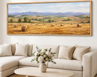 Quadro decorativo de parede com fardos de feno, tela rústica com paisagem rural, colinas onduladas, decoração neutra com horizonte campestre.