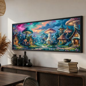 May include: A rectangular wall art print in a black frame depicting a fantasy landscape with mushroom-shaped houses, glowing windows, and a winding path under a vibrant, colorful sky filled with shades of pink, blue, and purple clouds.