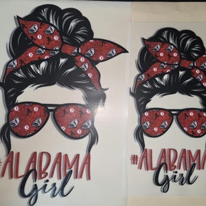 May include: A set of three ceramic mugs with a speckled, matte finish. The mugs are in shades of cream, light gray, and dark gray. Each mug has a simple, modern design and a rounded handle. The mugs are stacked on top of each other.