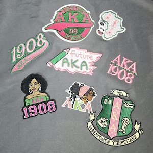 May include: A set of three ceramic mugs with a speckled, matte finish. The mugs are in shades of cream, light gray, and dark gray. Each mug has a simple, minimalist design, perfect for coffee or tea.