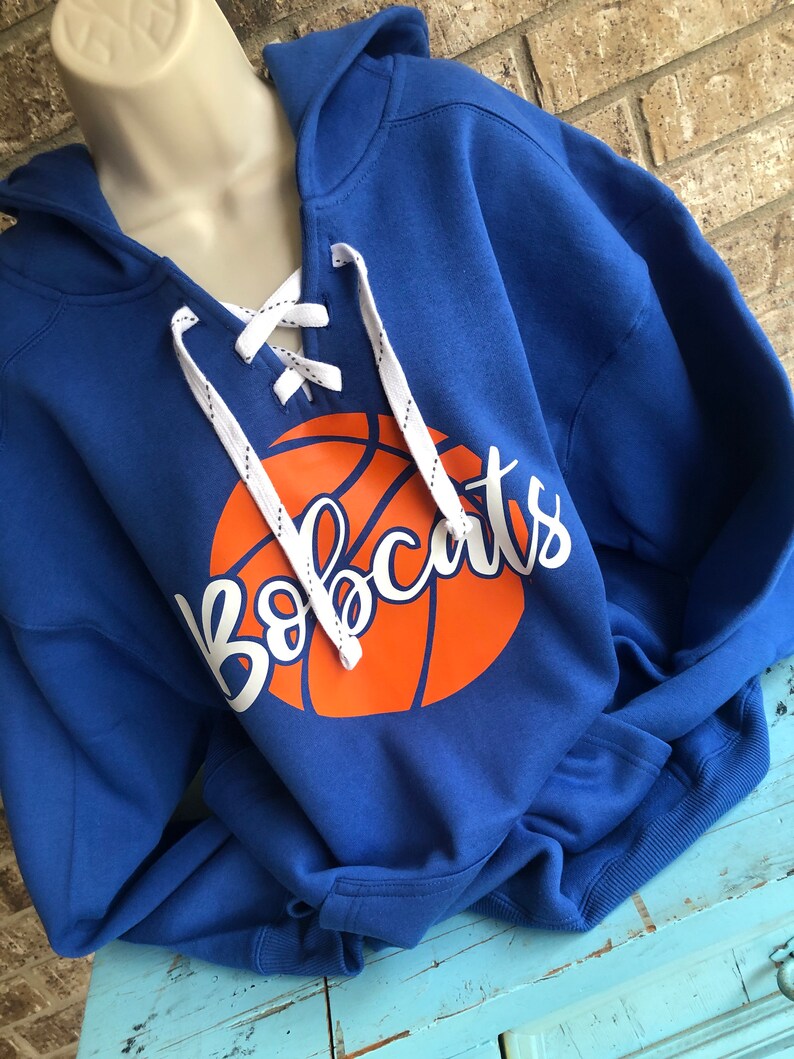 basketball jersey over a hoodie