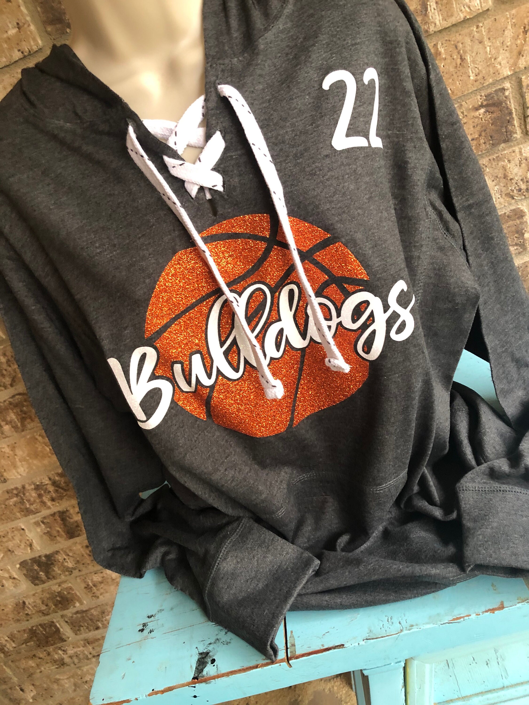 basketball jersey over a hoodie