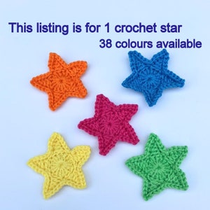 May include: Five crocheted stars in different colours: orange, blue, pink, yellow, and green. This listing is for 1 crochet star. 38 colours available.
