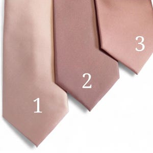 May include: Three silk ties in different shades of pink. The ties are numbered 1, 2, and 3.