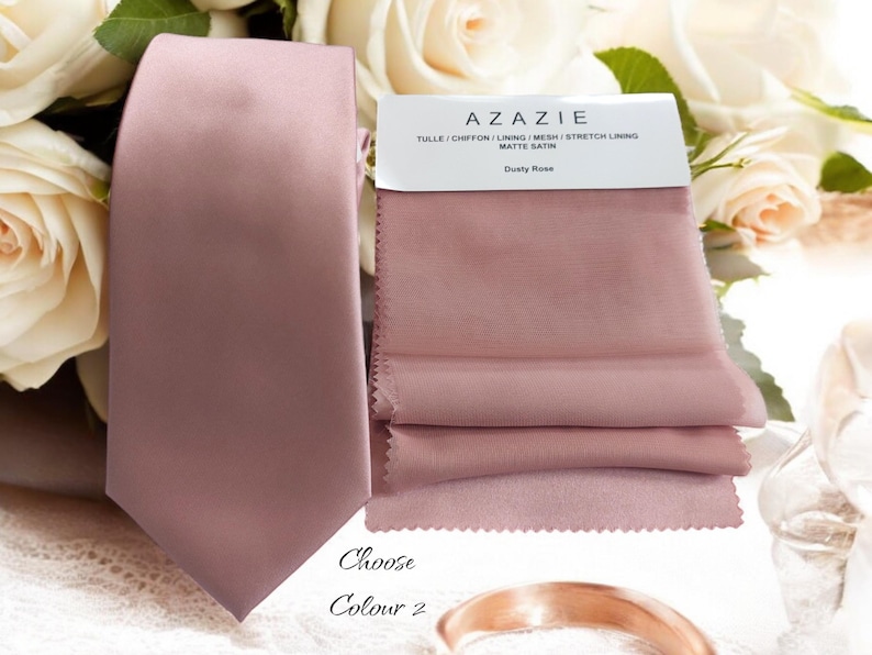 May include: A dusty rose satin tie with the text "Choose Colour 2" and a sample of dusty rose fabric with the text "Azazie Tulle | Chiffon | Lining | Mesh | Stretch Lining Matte Satin Dusty Rose".